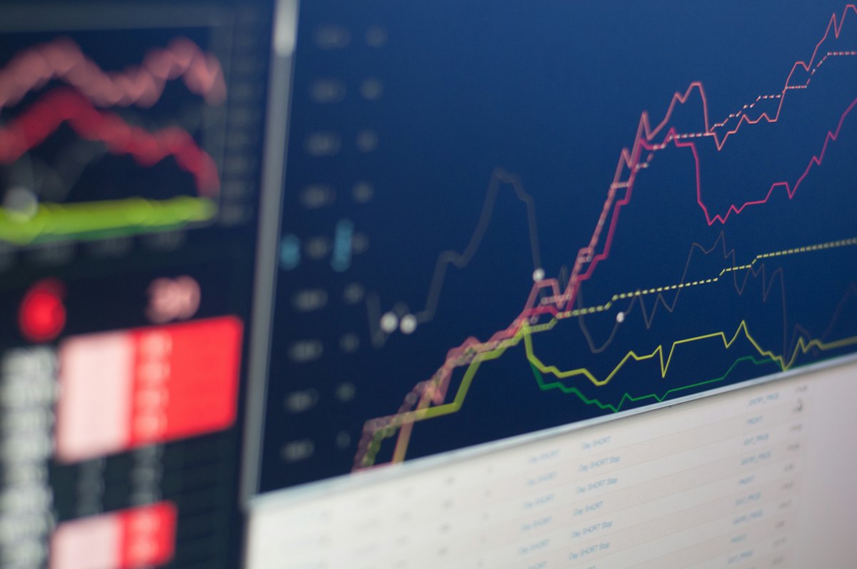 Blurred trading monitor with coloured price lines